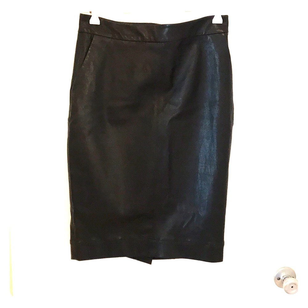Knee length black leather skirt